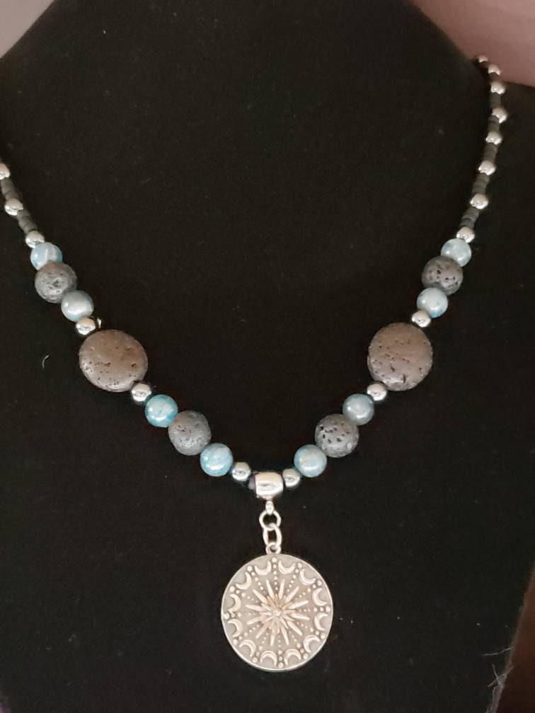 Sterling silver Sun and moon mandala on lava, apatite and hematite necklace