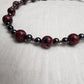 Red Jasper with Hematite and acrylic accents.