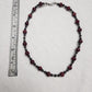 Red Jasper with Hematite and acrylic accents.