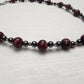 Red Jasper with Hematite and acrylic accents.